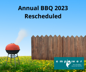 A red-lidded round charcoal barbecue sits on a grassy lawn with a wooden fence next to it. Title reads annual bbq 2023 rescheduled. The Empower logo is in the lower right corner. 