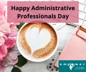 On a desk with pink flowers, a keyboard and a pink notebook, there is a latte with a heart in the foam. Title reads Happy Administrative Professionals Day! The Empower logo is in the lower right corner.