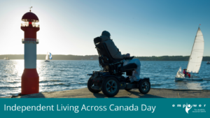 A person using a power wheelchair sits on a rock by the water, with sailboats and a light beacon. Title reads Independent Living Across Canada Day. The Empower N L logo is in the lower right corner.