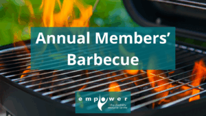 Close up of a charcoal grill with flames. Text reads Annual Members' Barbecue. The Empower N L logo is centered at the bottom.