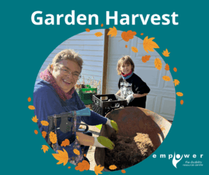 Empower N L member and friend work during the Garden Harvest. The Empower N L logo is in the lower right corner.