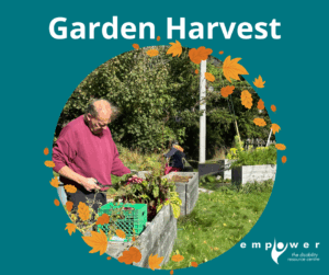 An Empower N L member harvests produce from accessible garden beds. Title reads Garden Harvest. The Empower N L Logo is in the lower right corner.