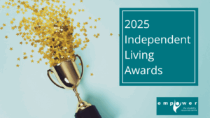 A cup trophy is tipped over with hundreds of gold stars spilling out of it. Title reads 2025 Independent Living Awards. The Empower N L logo is in the lower right corner.