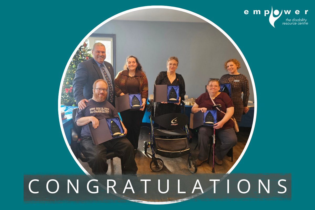 Winners of the 2025 Independent Living Awards pose holding their awards, with Minister Joedy Wall. Text reads Congratulations! The Empower N L logo is in the upper right corner.