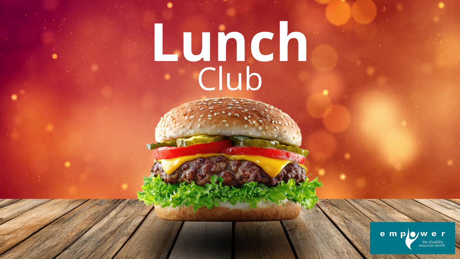A cheeseburger hovers above a wooden table with sparkly orange lights in the background. Title reads Lunch Club. The Empower N L logo is in the lower right corner.