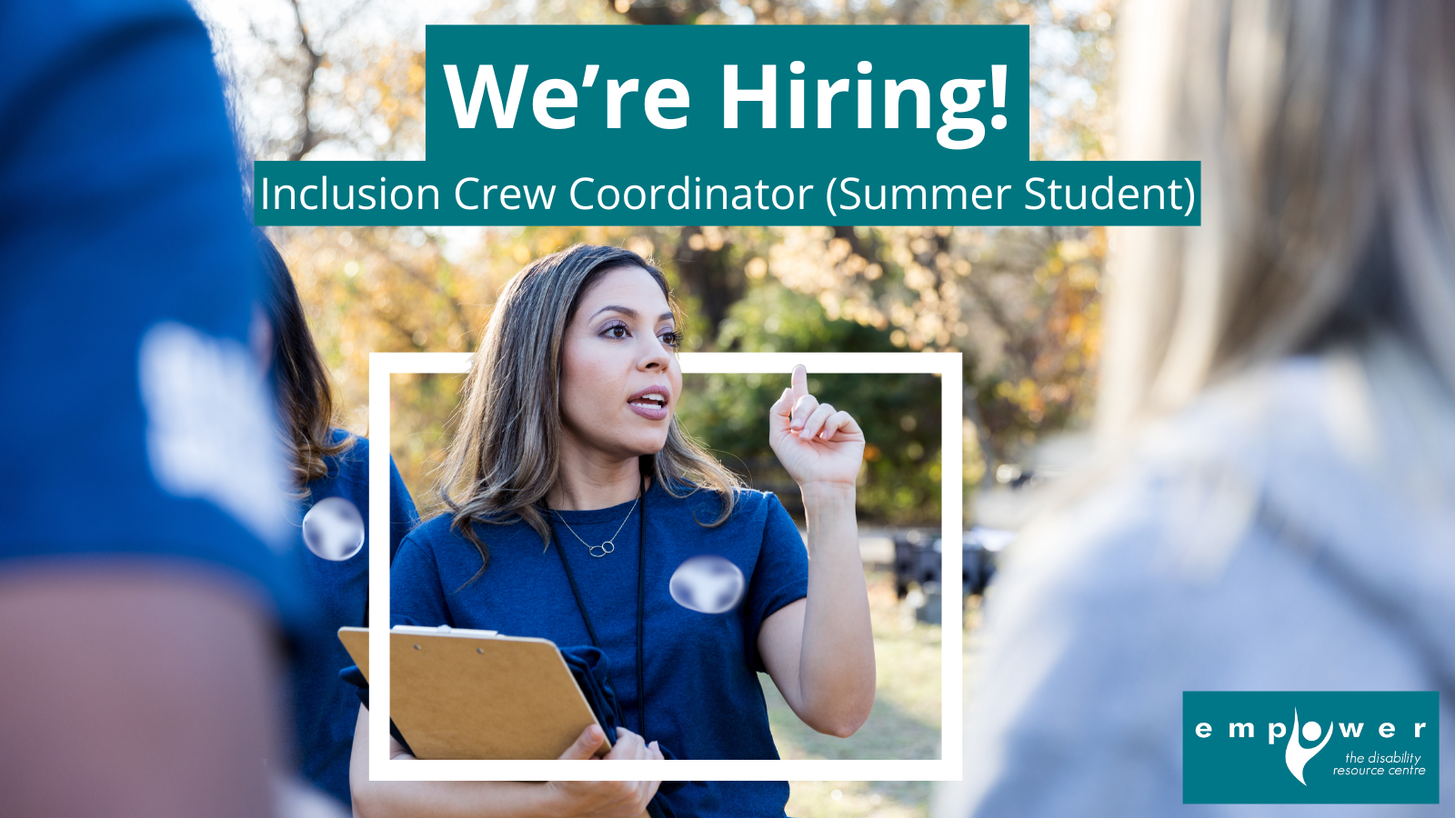 A woman stands, holding a clipboard, directing others in an outdoor setting. Text reads We're Hiring! Inclusion Crew Coordinator (Summer Student). The Empower N L logo is in the lower right corner.